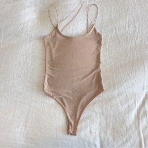 MISSY EMPIRE Asymmetrical Strappy One Piece Bodysuit in nude stone